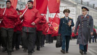 Russia has vetoed a U.N. Security Council resolution that would invalidate Sunday's referendum in Crimea. In Moscow, demonstrators and military veterans march in support of the Kremlin Saturday; nearby, a large march was held to protest Russia's policies. Alexander Zemlianichenko/AP