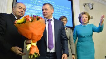 Vladimir Konstantinov (in purple tie) is the speaker of Crimea's parliament. He was welcomed with flowers Friday during his meeting with Valentina Matviyenko, speaker of Russia's upper house of parliament. She is at the far right of this photo. Yuri Kadobnov/AFP/Getty Images