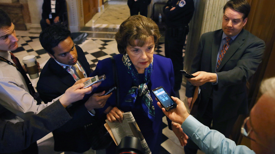 Sen. Dianne Feinstein speaks to reporters after speaking about her oversight committee's problematic relationship with the CIA Tuesday. CIA Director John Brennan says his agency isn't trying to delay the panel's report on the U.S. interrogation program. Mark Wilson/Getty Images