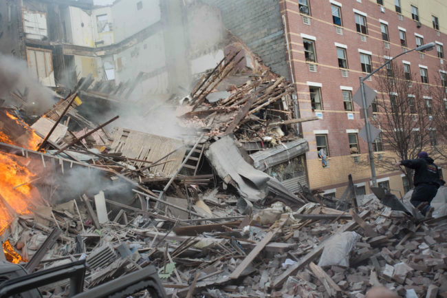 Two buildings collapsed in Harlem on Wednesday after an explosion and fire. Authorities say there were reports of a gas leak shortly before the blast/ Jeremy Sailing/AP
