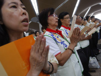 At Kuala Lumpur International Airport on Sunday, prayers were said for the 239 people who have been missing since flight MH370 disappeared. Lai Seng Sin/AP
