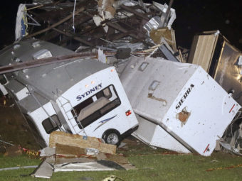 Travel trailers and motor homes were piled on top of each other at Mayflower RV in Mayflower, Ark., on Sunday after tornadoes carved through the central and southern U.S. Danny Johnston/AP