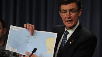 Angus Houston displays a map of the search area for missing Malaysia Airlines flight MH370 Monday. Houston says an Australian navy ship has detected underwater signals consistent with aircraft black boxes, calling it the "most promising lead" so far in the month-old search. AFP/AFP/Getty Images