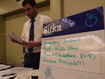 Blatchley Middle School Principal Ben White staffs the Sitka booth at the Seattle teaching fair. (KCAW photo/Ed Ronco)
