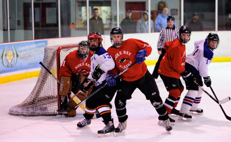Things get crowded in front of Killer Whales goalie Jason Soza as (from left) Jason Bluhm, Jason Amundson, Jason Hort and Sarah Lowell battle for position.