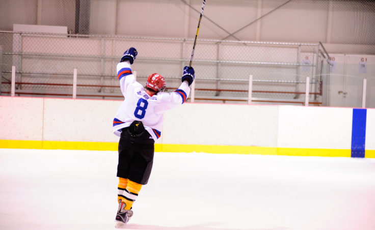 A-Bombs’ Arnold Liebelt celebrates a goal by teammate Greg Germain, who broke a 3-3 versus Dupont in the waning seconds of the 40+ Tier title game.