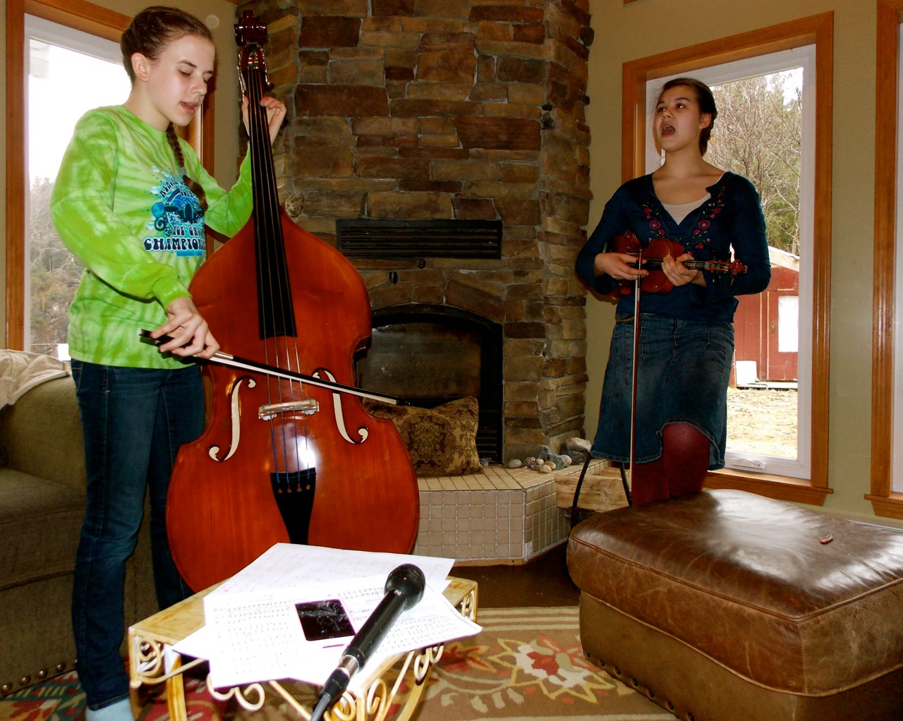 Kelsa Sperl, 15, sings while Erin Pfundt, 14, accompanies her on the bass. (Photo by Angela Denning/KFSK)