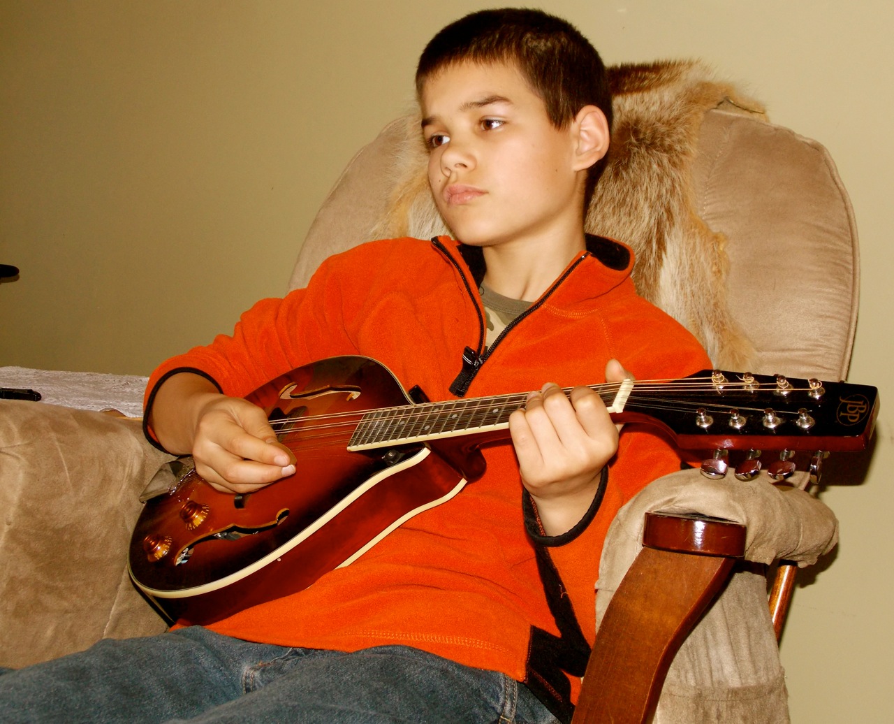 Kole Sperl, 11, plays mandolin in the Double Rock Band. (Photo by Angela Denning/KFSK)