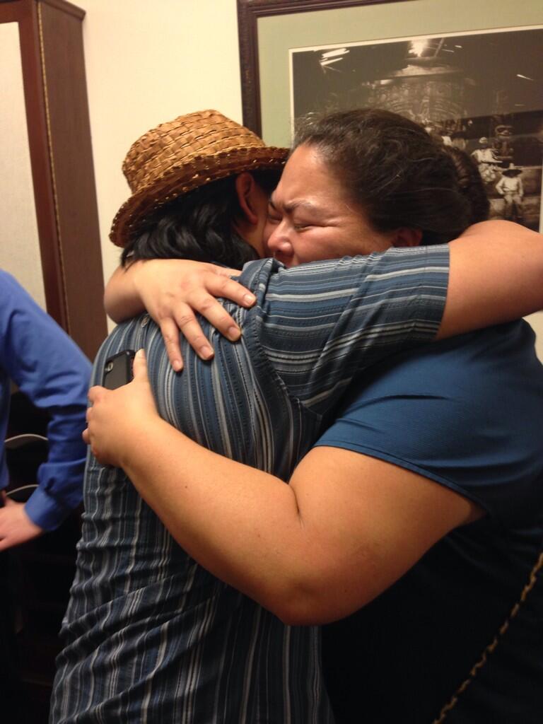 Lance Twitchell and Liz Medicine Crow embrace after HB 216 passed. (Photo by Casey Kelly/KTOO)