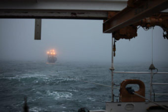 The Coast Guard Cutter Waesche tows the fishing vessel Alaska Mist through the Bering Sea near Amak Island, Alaska, Nov. 13, 2013. Joint effort between the crew of the Coast Guard Cutter Waesche, a Coast Guard Air Station Kodiak MH-60 Jayhawk helicopter crew, the 207-foot tug Resolve Pioneer and the fishing vessel Pavlof resulted in the successful tow of the Alaska Mist and safe disembarkation of the crew to Dutch Harbor. (U.S. Coast Guard photo by Coast Guard Cutter Waesche)