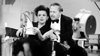 Judy Garland and Mickey Rooney put their heads together over a TV script for their first onstage reunion in 18 years in this 1963 photo. AP