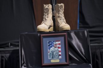 A memorial for Staff Sgt. Carlos Lazaney Rodriguez is seen before a service at Fort Hood on Wednesday. Brendan Smialowski /AFP/Getty Images