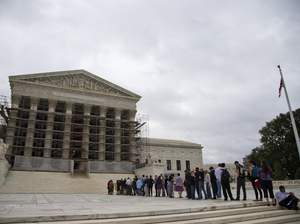 People wait in line for the beginning of the Supreme Court 2013-2014 opening term in Washington, on Oct. 7, 2013. They heard the first major case on campaign contribution limits since the landmark 2010 Citizens United. Evan Vucci/AP