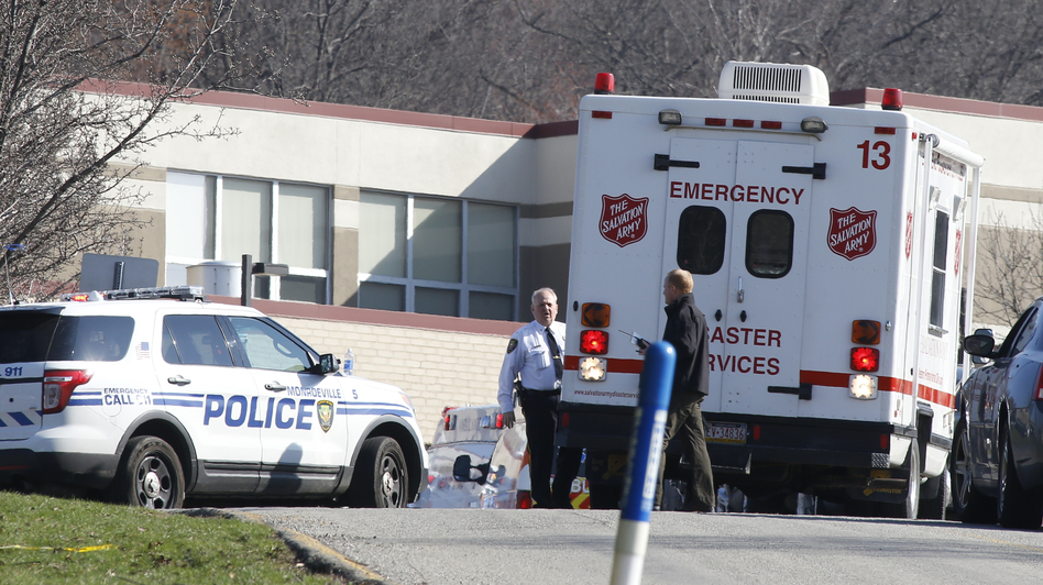 Emergency responders gather in the parking lot on the campus of Franklin Regional High School in Murraysville, Pa., on Wednesday after an attack there left at least 20 people, nearly all of them students, injured. Most suffered stab wounds or lacerations. Keith Srakocic/AP