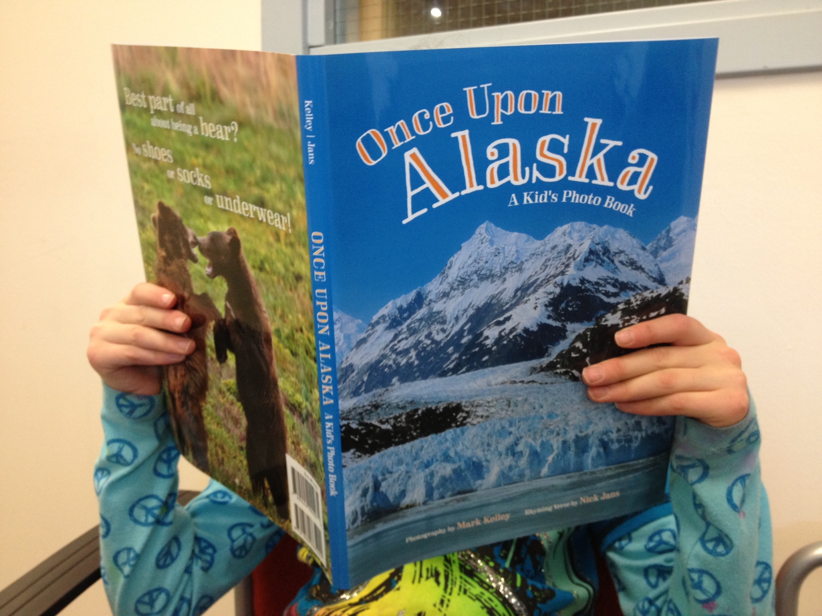 "Once Upon Alaska, A Kid's Photo Book" is a collaboration between writer Nick Jans and photographer Mark Kelley. (Photo by Lisa Phu/KTOO)