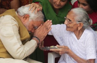 India's next prime minister, Narendra Modi, receives a blessing from his mother at her home in the western state of Gujarat on Friday, as election results showed a resounding win for Modi's opposition party. Ajit Solanki/AP
