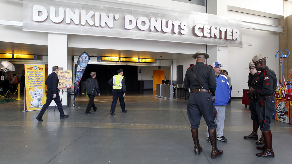 Rhode Island state troopers and Providence police stand in the lobby of the Dunkin' Donuts Center after an accident during the Ringling Bros. and Barnum & Bailey Circus performance Sunday. Stew Milne/AP