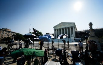 Members of the media camp outside the U.S. Supreme Court in June of 2013. Jim Watson /AFP/Getty Images