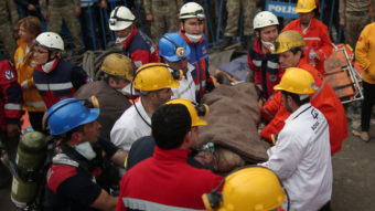 Rescue workers carry a man from the coal mine in Soma, western Turkey, site of a disaster that has killed more than 200 people. Emrah Gurel/AP