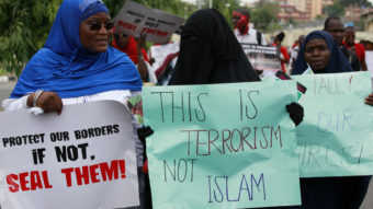 Muslim women march as part of a call for Nigeria's government to increase efforts to rescue more than 200 girls who were kidnapped from their school last month. Sunday Alamba/AP