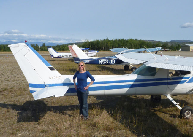 Jessica Cherry in Bettles, Alaska, posing with the three planes she used for her private, instrument and commercial flight training. (Photo courtesy Jessica Cherry)
