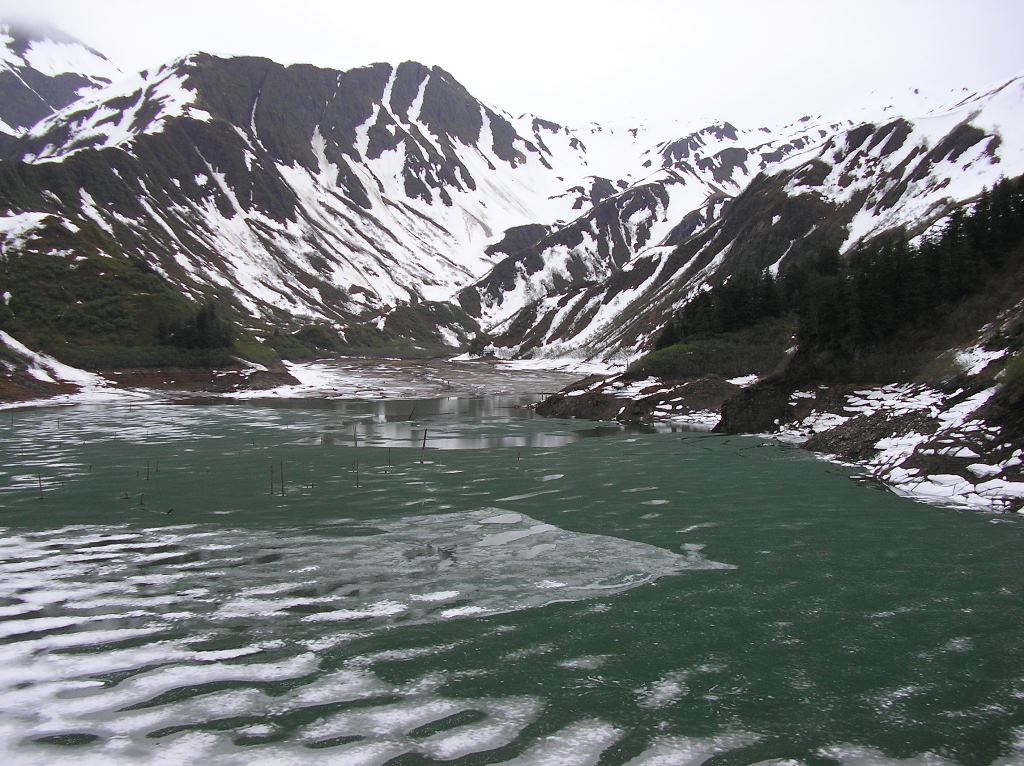 Salmon Creek reservoir, May 26, 2009.  Water level is within a foot or two of the current elevation, but there's more ice on the lake and snow on the hillsides. (Photo courtesy Scott Willis/ AEL&P)