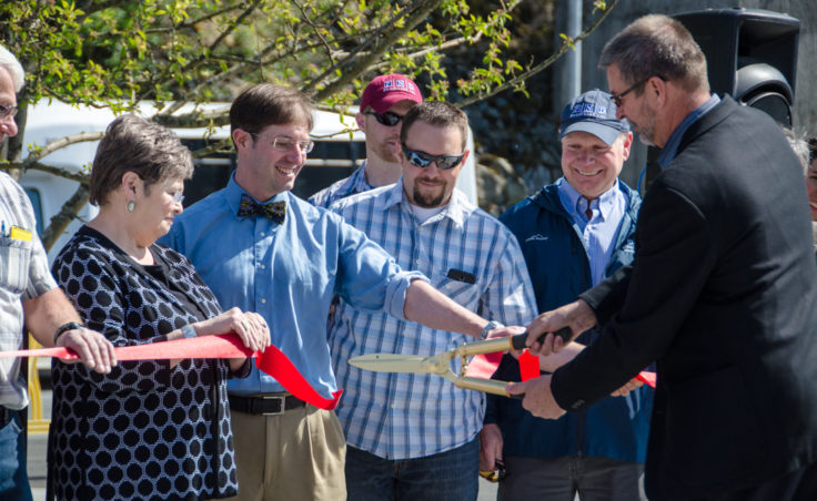 Kirby Day, director of shore operations for Princess Cruises, cuts the ribbon. (Photo by Heather Bryant/KTOO)