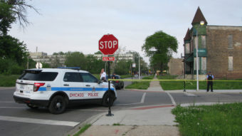 Police cordon off the area around a shooting in Chicago Wednesday. The violence broke out down the street from where an interview about guns in the city was being conducted. David Schaper /NPR