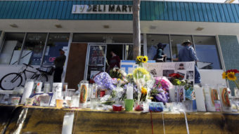 A makeshift memorial sits in front of IV Deli Mart, where part of Friday night's mass shooting took place in the Isla Vista, Calif., community. The parents of Elliot Rodger, accused of killing six people, were reportedly rushing to try to stop their son when they heard about the violence. Chris Carlson/AP