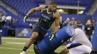 Michael Sam runs a drill at the NFL football scouting combine in Indianapolis in February. Sam was picked in the seventh round of the NFL draft by the St. Louis Rams. Michael Conroy/AP
