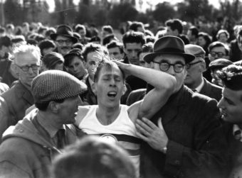 English athlete Roger Bannister among a crowd at Oxford after becoming the first person in the world to run a mile in under 4 minutes (3:59.4). Norman Potter/Getty Images