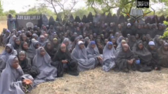 A still image taken from a video that the extremist group Boko Haram says is of more than 100 girls who were abducted from a Nigerian school last month. AFP/YouTube