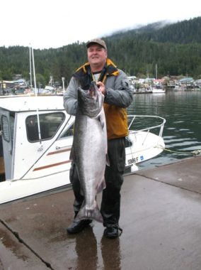 Jan Herron displays the 41.2-pound fish that won Wrangell’s 2008 derby (KSTK)