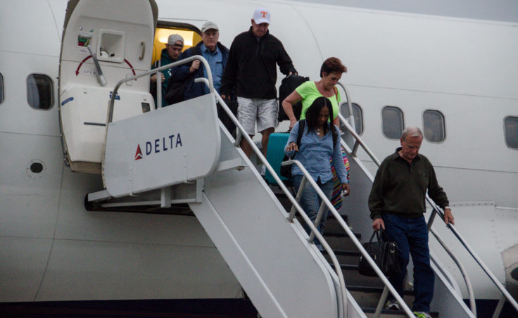The first passengers from Delta arrive in Juneau. (Photo by Heather Bryant/KTOO)