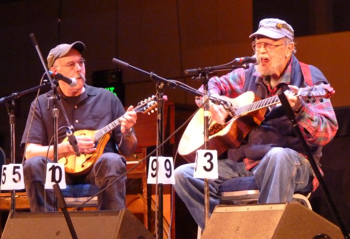 Juneau’s Bob Banghart, left, and Pat Henry, right, performing as We’re Still Here in April’s Alaska Folk Festival. The two are the only musicians to have played at all the events.