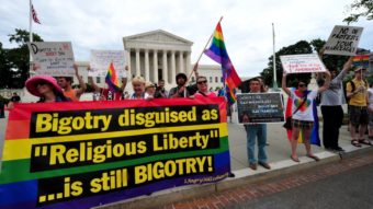 The Obama administration is set to announce expanded federal benefits for same-sex spouses, no matter what state they live in. On Thursday, demonstrators supporting same-sex marriage marched in front of the Supreme Court. Karen Bleier/AFP/Getty Images