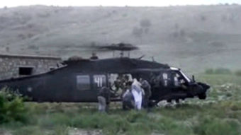 A video released by the Taliban shows Sgt. Bowe Bergdahl being bundled into a U.S. helicopter in eastern Afghanistan on Saturday. AP