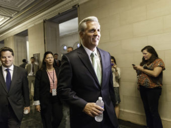 Kevin McCarthy of Calif. arrives with his GOP House allies for leadership elections on Thursday. McCarthy won his bid to replace outgoing Rep. Eric Cantor as the party's majority leader. J. Scott Applewhite/AP