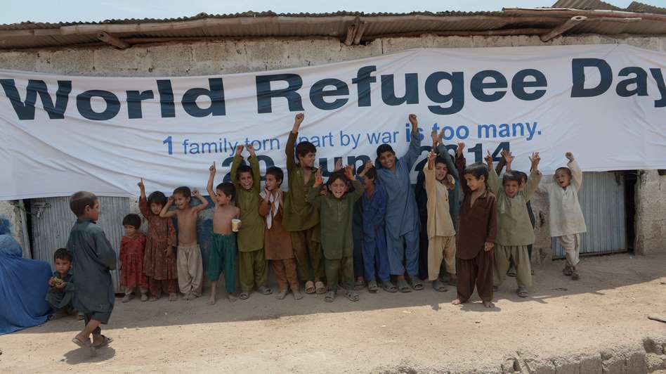 Afghan children gather at a special medical camp set up by UNHCR to mark World Refugees Day in Islamabad Friday. The UN agency says there were 51.2 million displaced people at the end of 2013, 6 million higher than the previous year. Farooq Naeem/AFP/Getty Images
