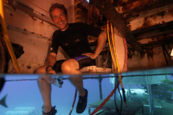 Fabien Cousteau sits inside Aquarius Reef Base in 2012. If he is able to remain under water for 31 days, he will have lasted one day longer than his grandfather, Jacques Cousteau. Mark Widick/AP
