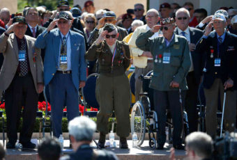 World War II veterans salute as "Taps" is played at a ceremony at the Normandy American Cemetery marking the 70th anniversary of D-Day, June 6, 2014, in Colleville-sur-Mer, France. Win McNamee/Getty Images