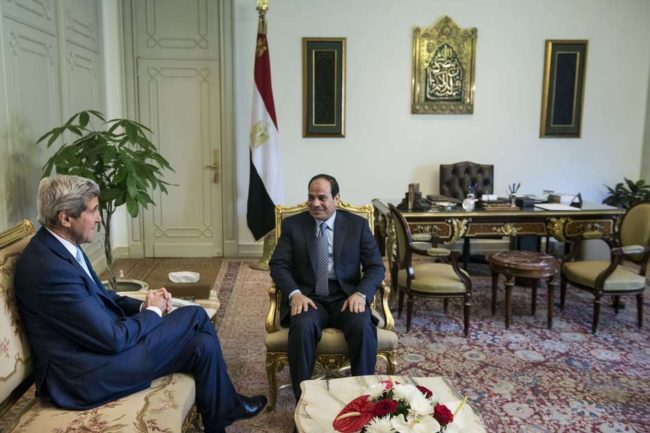 Egyptian President Abdel-Fattah el-Sissi and U.S. Secretary of State John Kerry talk before a meeting at the Presidential Palace on Sunday in Cairo. Brendan Smialowski/AFP/Getty Images
