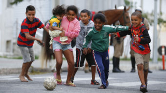They are feeling it: Children kick around a soccer ball outside the Independencia Stadium in Belo Horizonte, Brazil, on Wednesday. Victor R. Caivano/AP