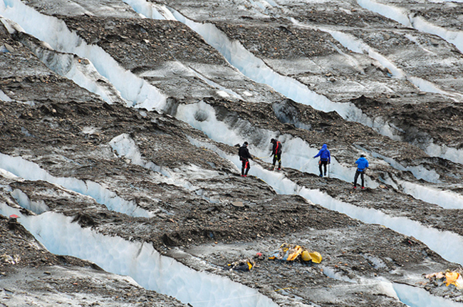 Search teams retrieving debris from the crash in 2012. (Photo courtesy DoD/Cpt. Jamie D. Dobson, U.S. Army)