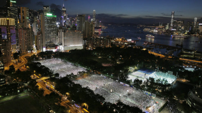 Tens of thousands of people attend a candlelight vigil at Victoria Park in Hong Kong Wednesday to mark the 25th anniversary of the Chinese military crackdown on pro-democracy protests in Beijing. Vincent Yu/AP