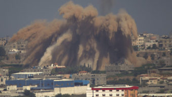 Smoke and debris rise after an Israeli strike on the Gaza Strip Wednesday. Since the Gaza offensive began Tuesday, Israel has attacked more than 400 sites in Gaza. Ariel Schalit/AP