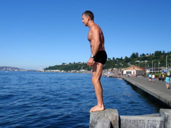 Swimmer Wayne Kinslow prepares to dive into Puget Sound at Alki Beach, a place he personally paid to have tested for traces of Fukushima radiation. (Photo by Tom Banse/NNN)