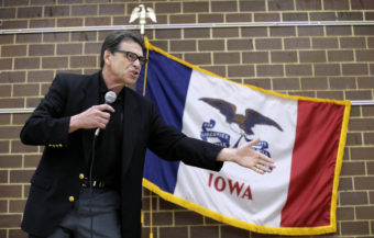 Texas Gov. Rick Perry speaks to local party activists on Saturday in Algona, Iowa. After his presidential bid crashed in 2012, Iowans now have to decide whether to give Perry another spin. Charlie Neibergall/AP
