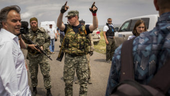 Pro-Russian rebels move journalists away from Malaysian investigators and monitors from the Organization for Security and Cooperation in Europe Tuesday. Malaysia Airlines flight MH17 was allegedly shot down by a missile Thursday; today, U.S. intelligence says it has verified that two rebel leaders spoke by phone about shooting the plane down. Rob Stothard/Getty Images