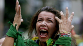A fan screams as she watches Brazil lose to Germany, in a live telecast in Belo Horizonte, Brazil, Tuesday. The host nation is reeling from its loss in the World Cup semifinal. Bruno Magalhaes/AP